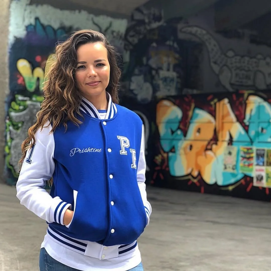Blue Varsity Jacket With White Shirt And Denim