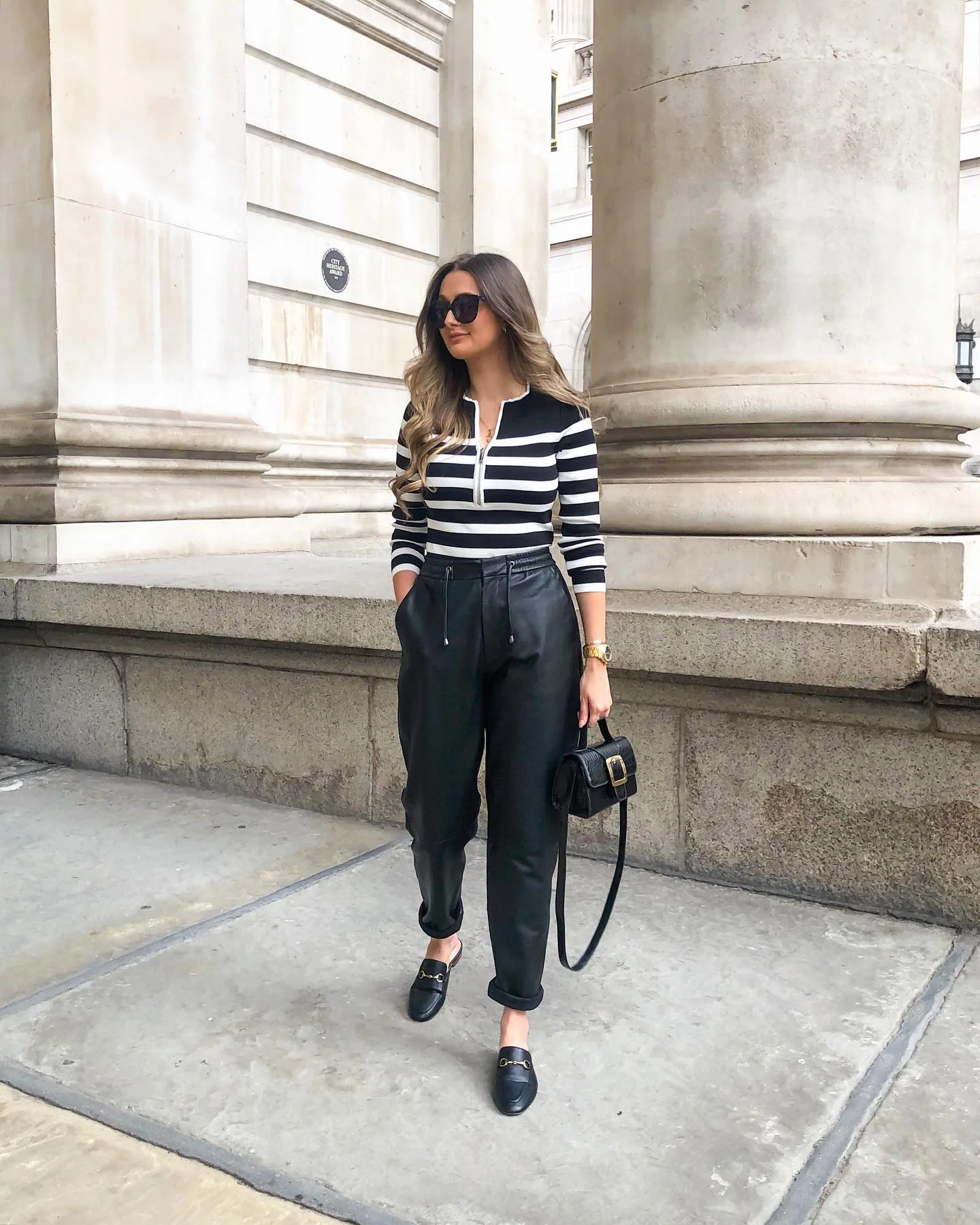 Chic Black Leather Trousers With Striped Zip-Up Top
