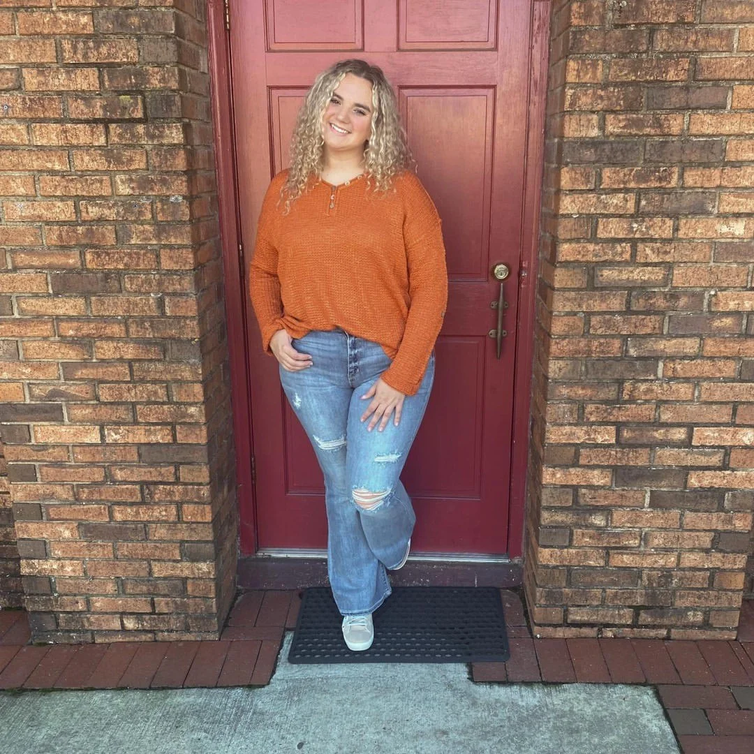 Cozy Terracotta Sweater And Distressed Denim Look