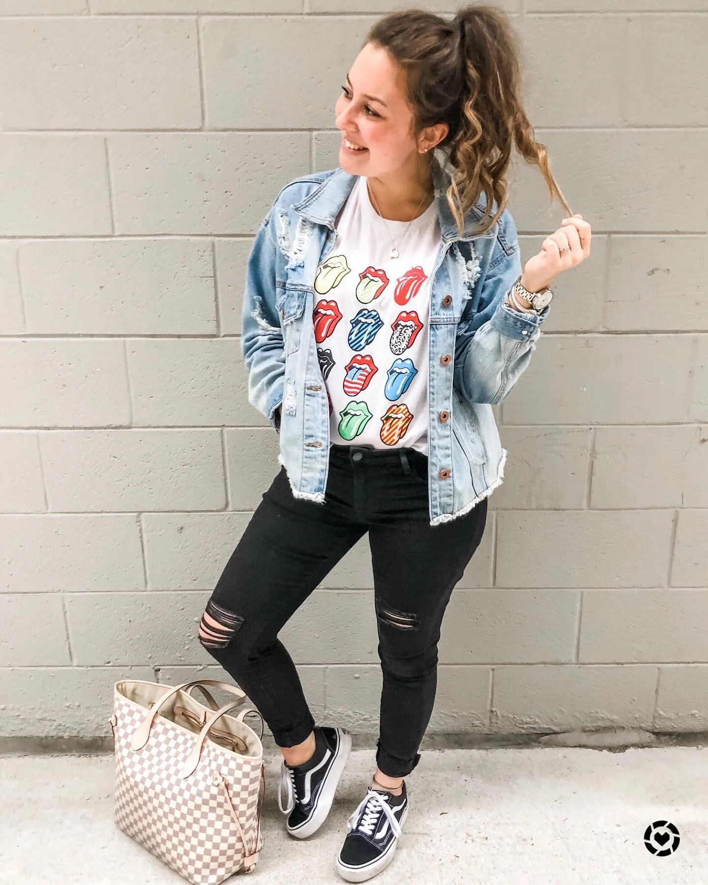 Distressed Denim Jacket With Graphic Tee And Black Jeans