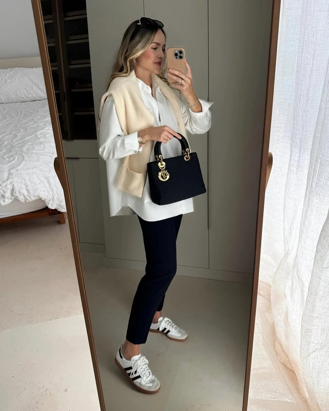 Effortless Cream Vest Over White Shirt and Navy Trousers