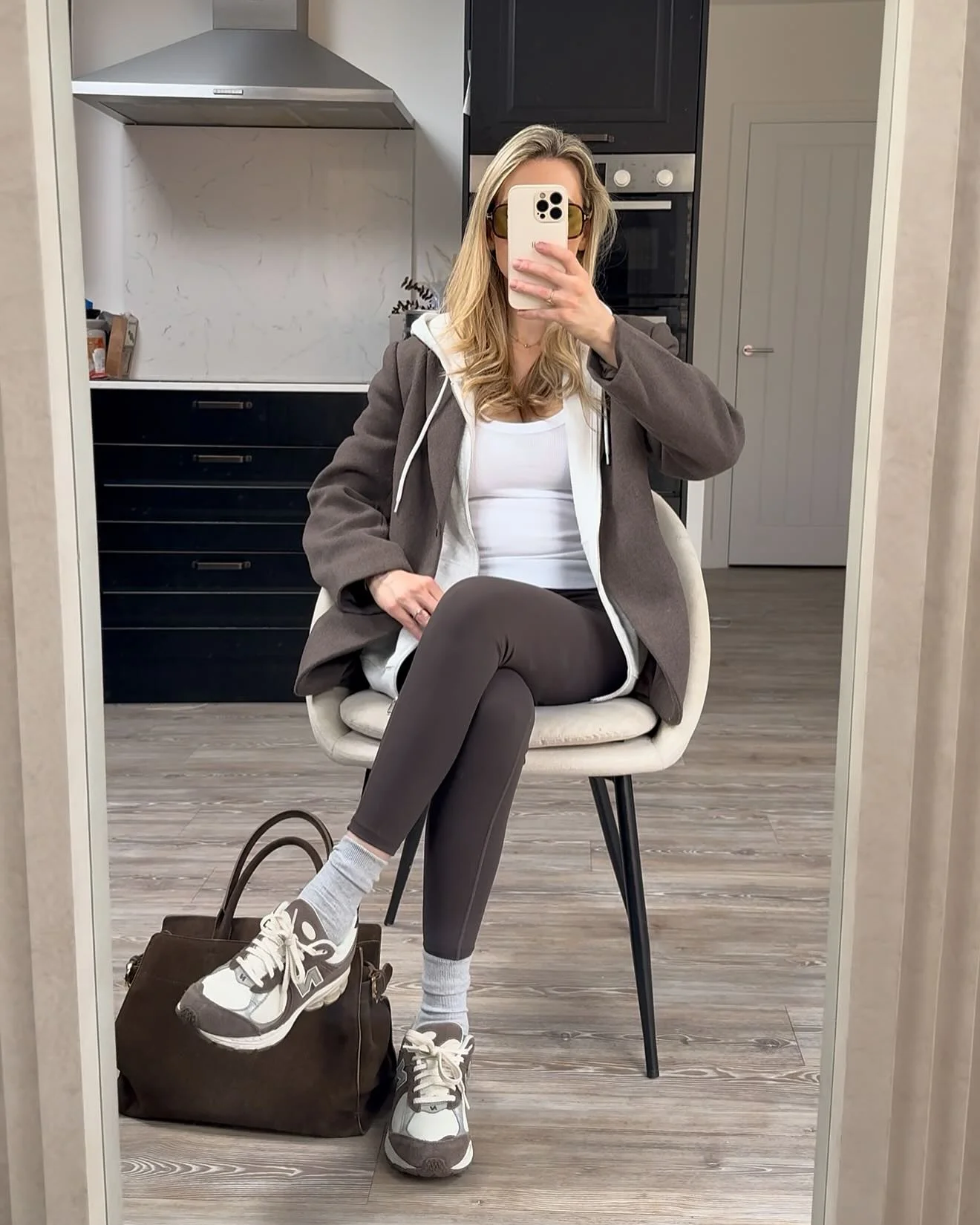 Elevated Athleisure: Brown Blazer Over White Tank And Leggings