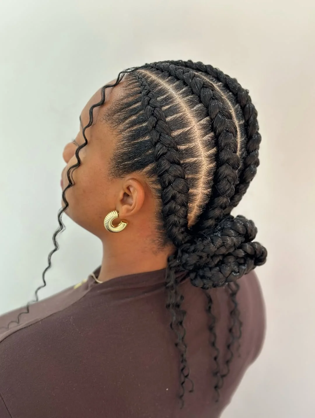 Ghana Braids Updo With Curly Wisps And Edges