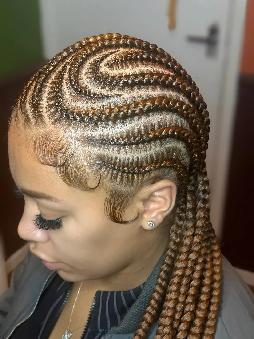 Golden Brown Swirl Cornrows With Laid Edges