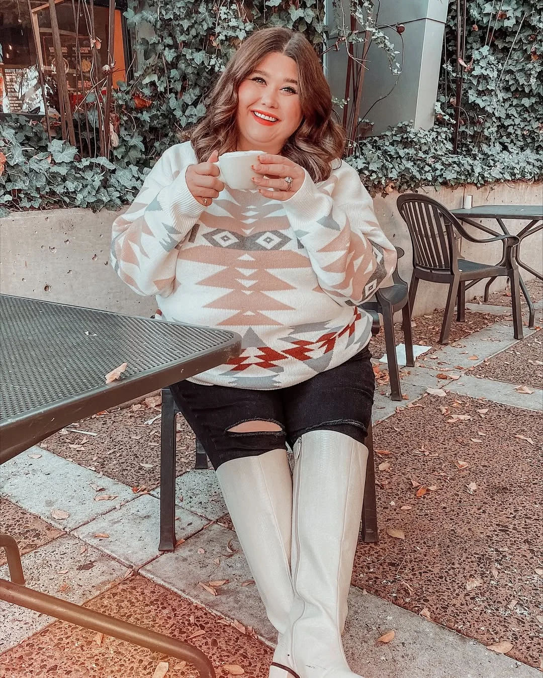 Graphic Print Sweater With Ripped Jeans And Boots