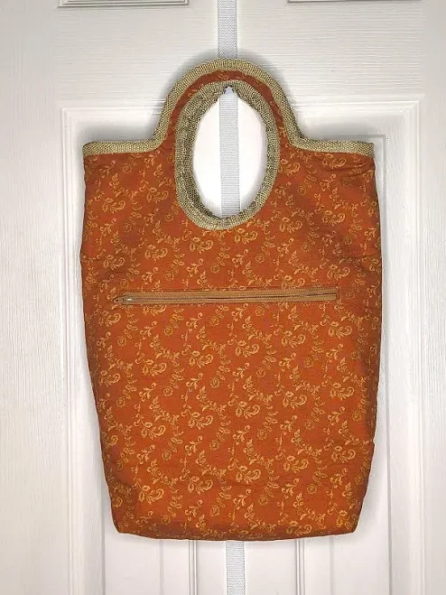 Handmade Tote for an Adult in Rust/Bronze and Gold Print, Inside Slit Pocket, Outside Zipper Pocket, Round Handle Closure.