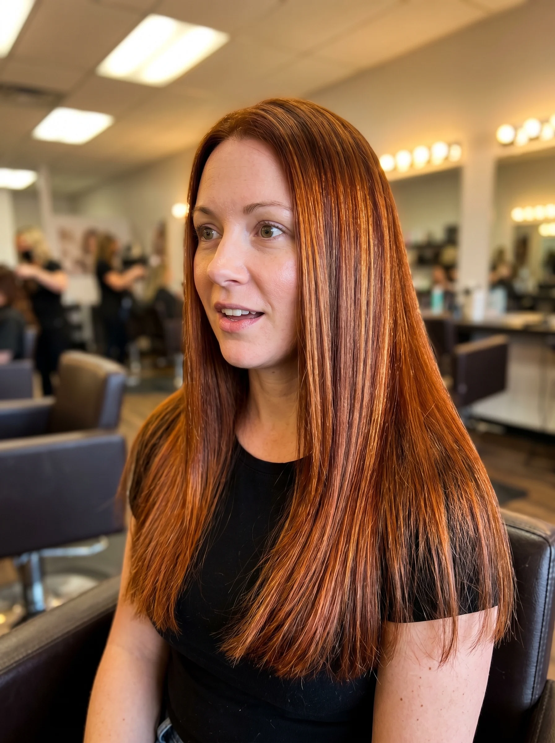 Luxurious 'Copper-Gold Ribboning' hair, showcasing dramatic burnished copper and deep auburn tones with 24k gold, a rich option for copper hair summer ideas 2026.
