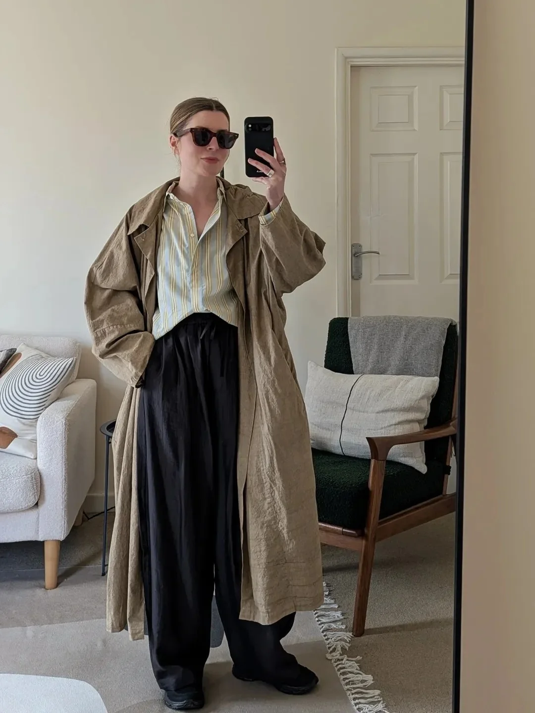 Monochromatic Black Trousers With Khaki Trench