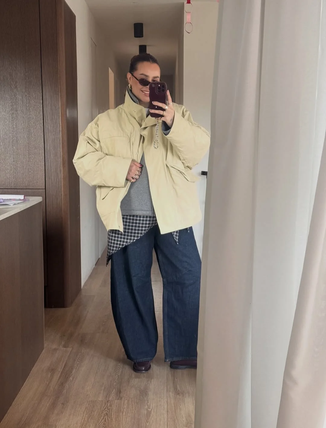 Oversized Puffer Layered Over Plaid Shirt Look