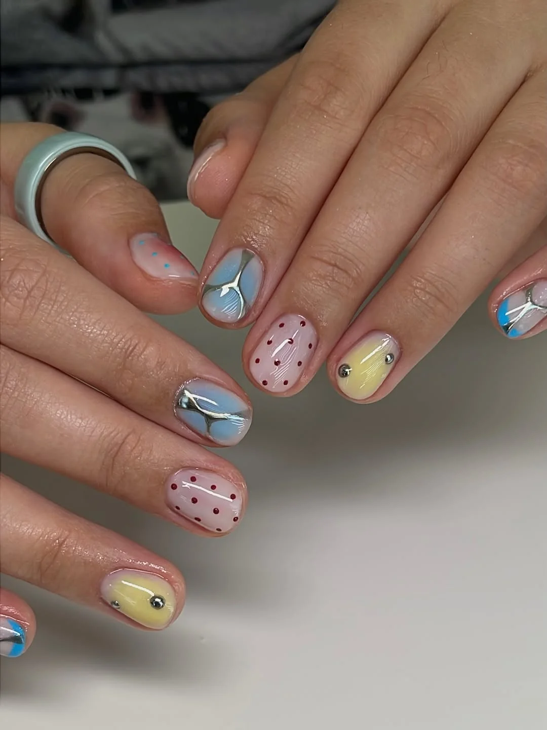 Playful Pastel Mismatched Nails With Chrome Accents