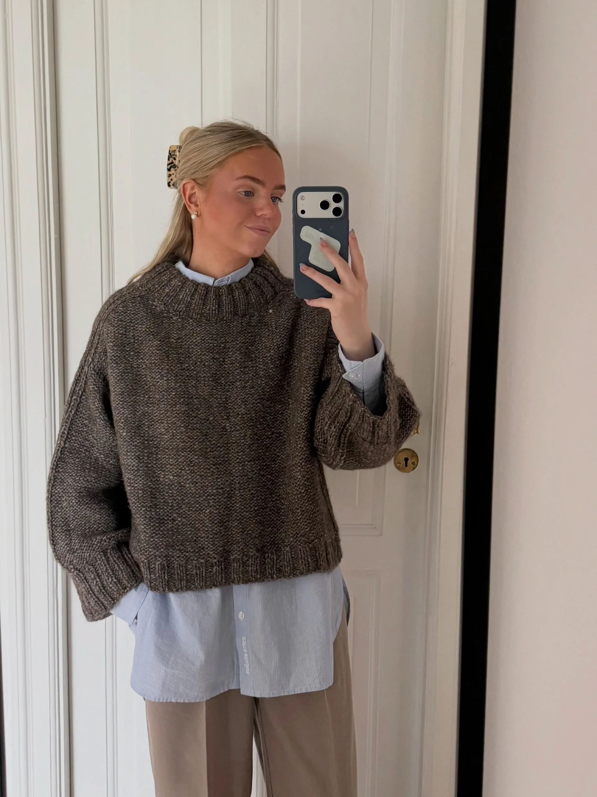 Textured Knit Sweater Over Striped Button-Down